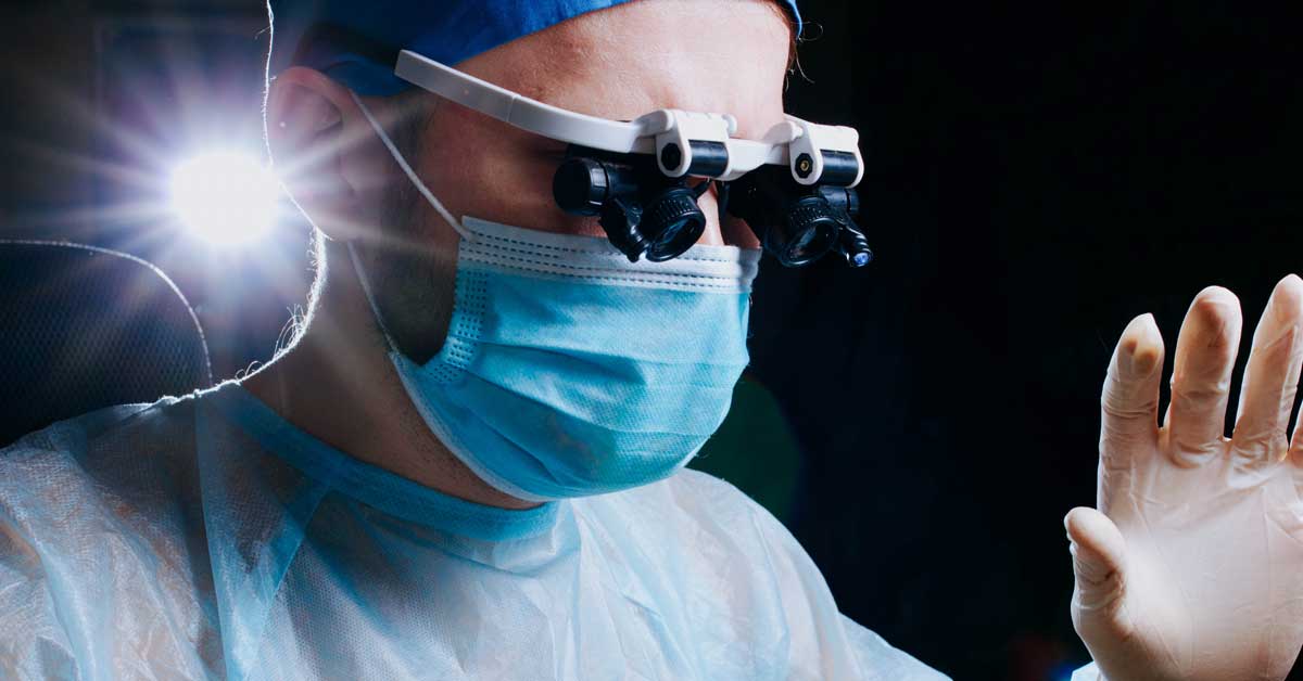 Neurosurgeon performing neurosurgery in operating theatre Brisbane
